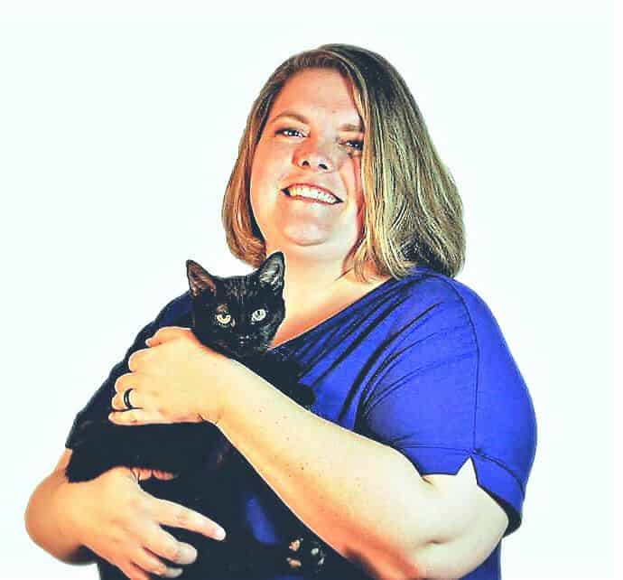 Sheena Keliher holding a black cat